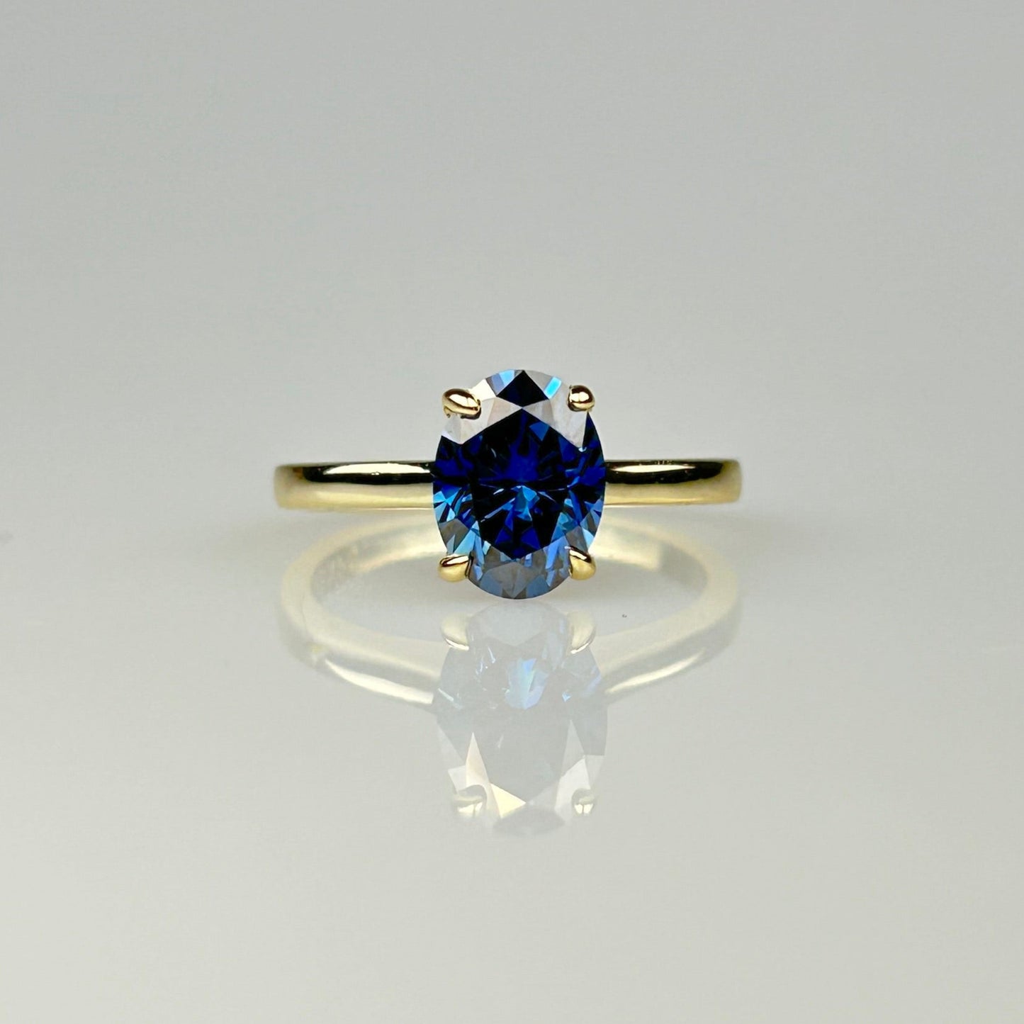Blue Oval Solitaire Ring