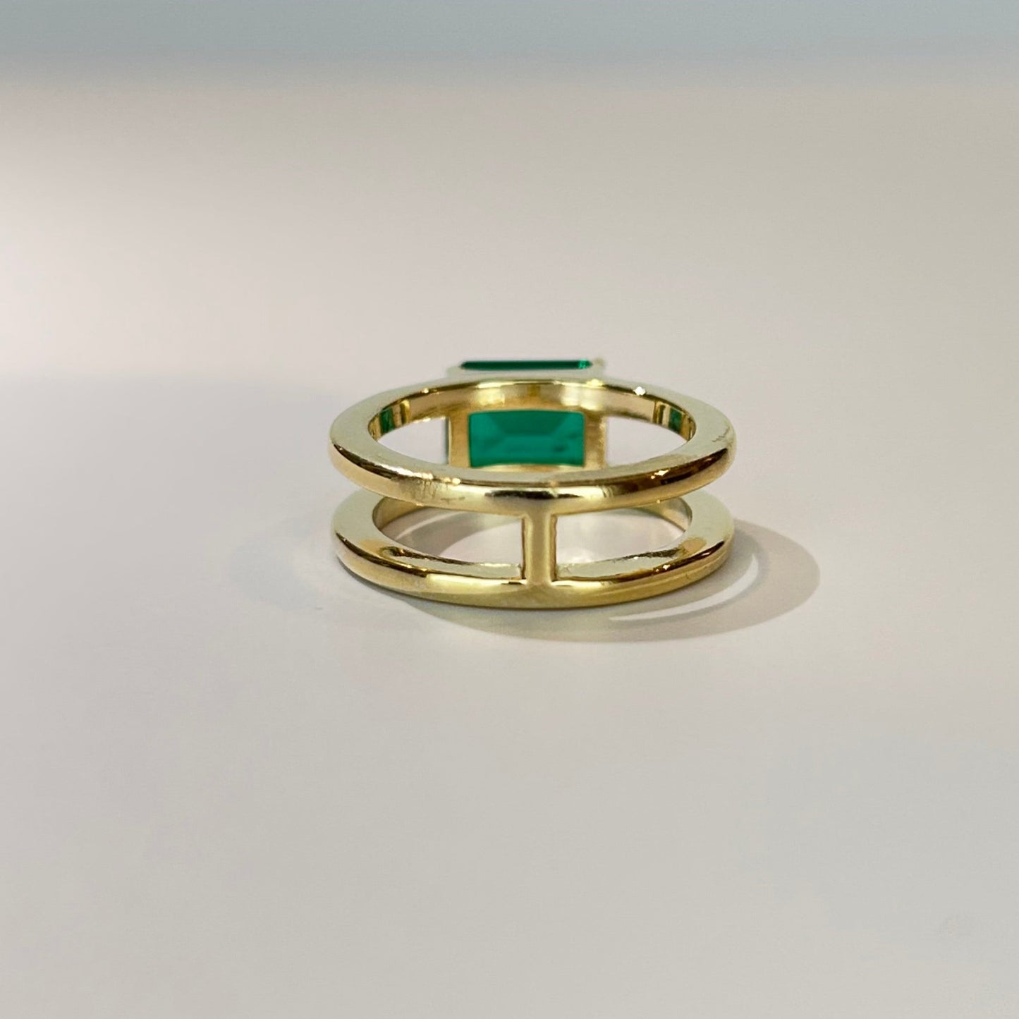 East West Emerald Gemstone with Double Open Band