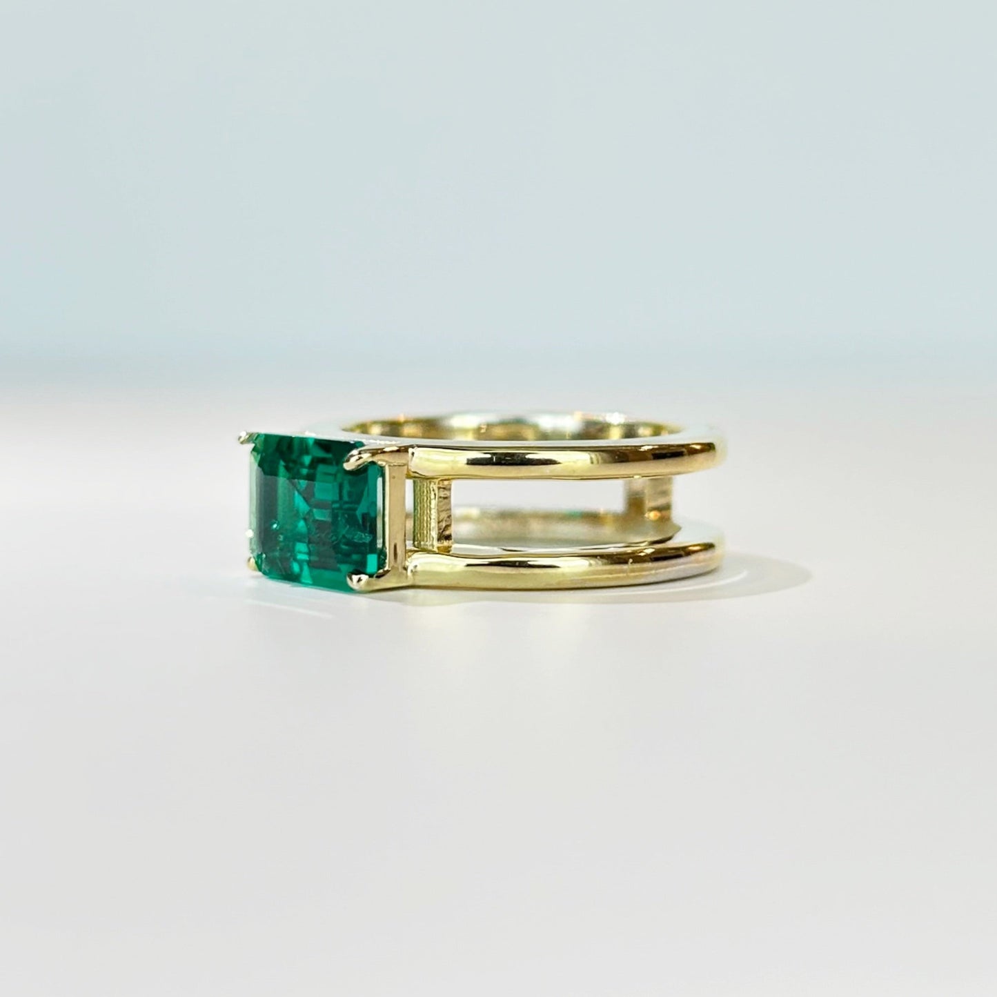 East West Emerald Gemstone with Double Open Band