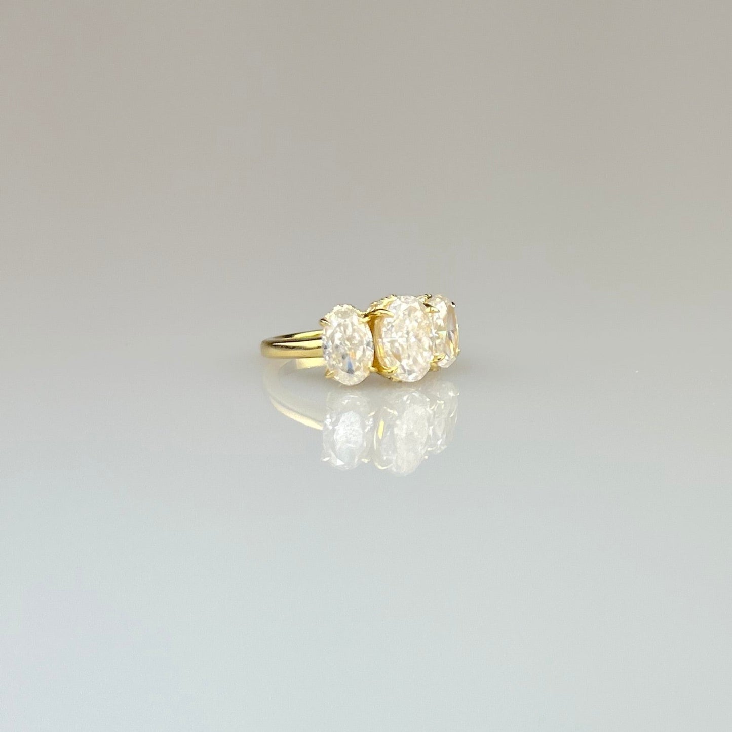 Three Stone Oval Ring with Hidden Halos