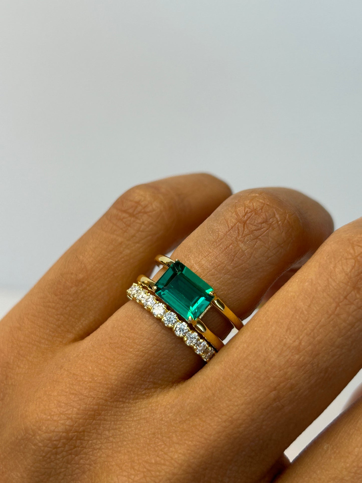 East West Emerald Gemstone with Double Open Band
